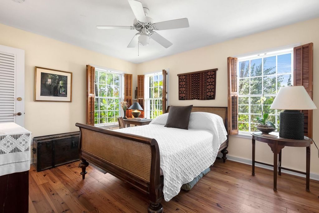 Discover luxury in the Florida Keys with this historic 5-bedroom, 5.5-bathroom home, situated at 400 South St, Key West, FL 33040. Adjacent to the iconic Southernmost Point buoy, this 4,008 square feet residence blends historic charm with modern amenities.