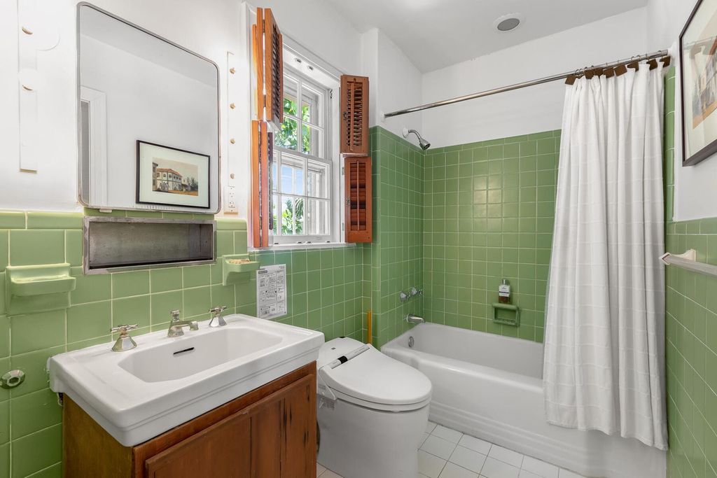 Discover luxury in the Florida Keys with this historic 5-bedroom, 5.5-bathroom home, situated at 400 South St, Key West, FL 33040. Adjacent to the iconic Southernmost Point buoy, this 4,008 square feet residence blends historic charm with modern amenities.
