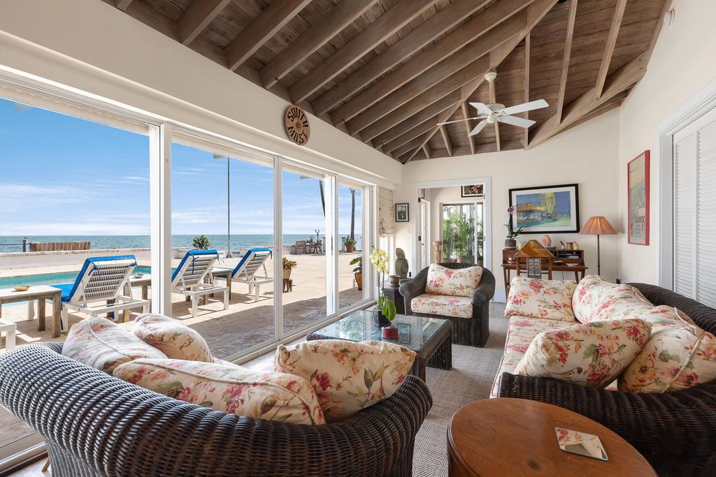 Discover luxury in the Florida Keys with this historic 5-bedroom, 5.5-bathroom home, situated at 400 South St, Key West, FL 33040. Adjacent to the iconic Southernmost Point buoy, this 4,008 square feet residence blends historic charm with modern amenities.