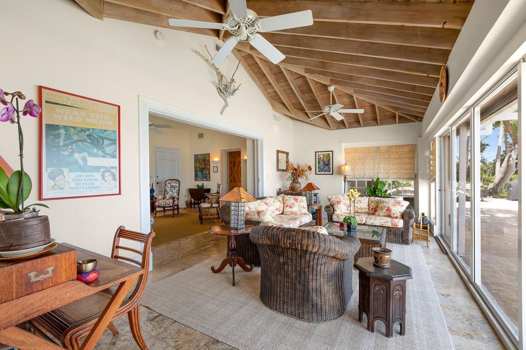 Discover luxury in the Florida Keys with this historic 5-bedroom, 5.5-bathroom home, situated at 400 South St, Key West, FL 33040. Adjacent to the iconic Southernmost Point buoy, this 4,008 square feet residence blends historic charm with modern amenities.