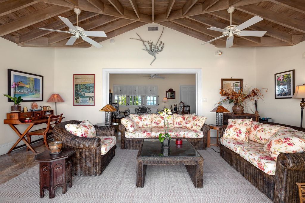 Discover luxury in the Florida Keys with this historic 5-bedroom, 5.5-bathroom home, situated at 400 South St, Key West, FL 33040. Adjacent to the iconic Southernmost Point buoy, this 4,008 square feet residence blends historic charm with modern amenities.