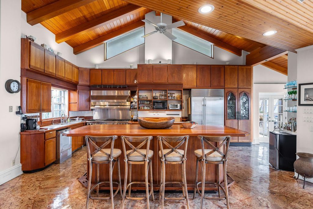 Discover luxury in the Florida Keys with this historic 5-bedroom, 5.5-bathroom home, situated at 400 South St, Key West, FL 33040. Adjacent to the iconic Southernmost Point buoy, this 4,008 square feet residence blends historic charm with modern amenities.