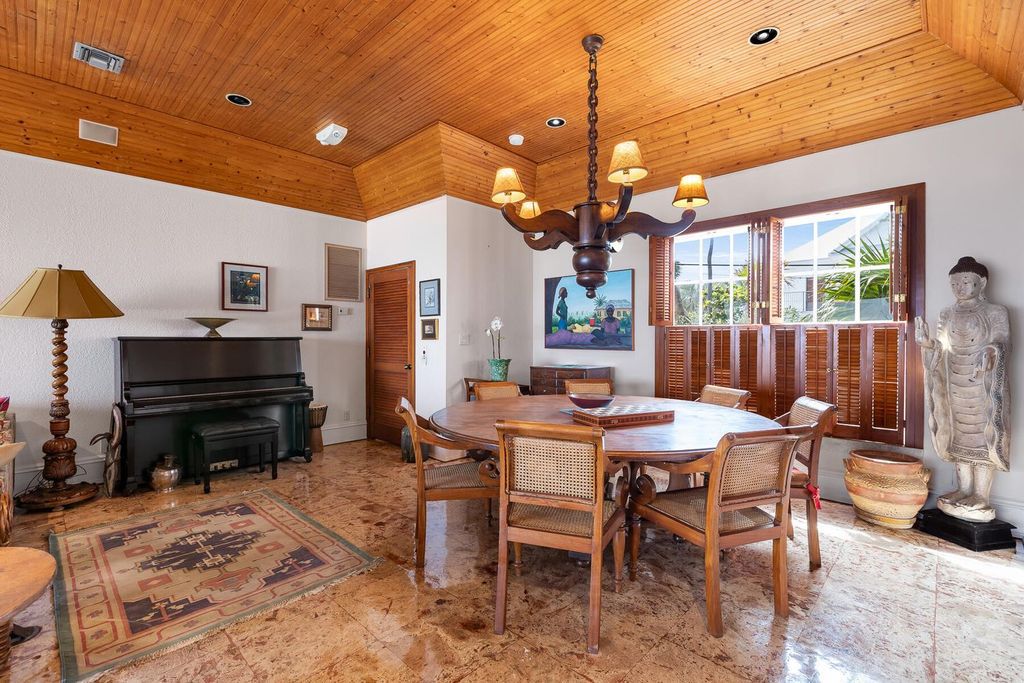 Discover luxury in the Florida Keys with this historic 5-bedroom, 5.5-bathroom home, situated at 400 South St, Key West, FL 33040. Adjacent to the iconic Southernmost Point buoy, this 4,008 square feet residence blends historic charm with modern amenities.