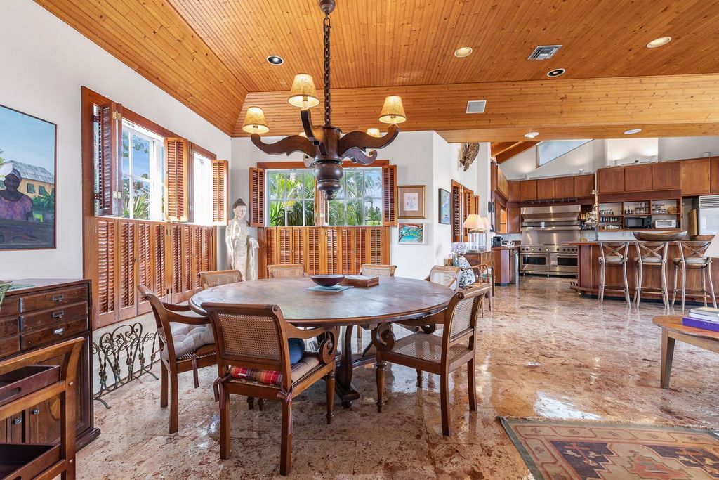 Discover luxury in the Florida Keys with this historic 5-bedroom, 5.5-bathroom home, situated at 400 South St, Key West, FL 33040. Adjacent to the iconic Southernmost Point buoy, this 4,008 square feet residence blends historic charm with modern amenities.