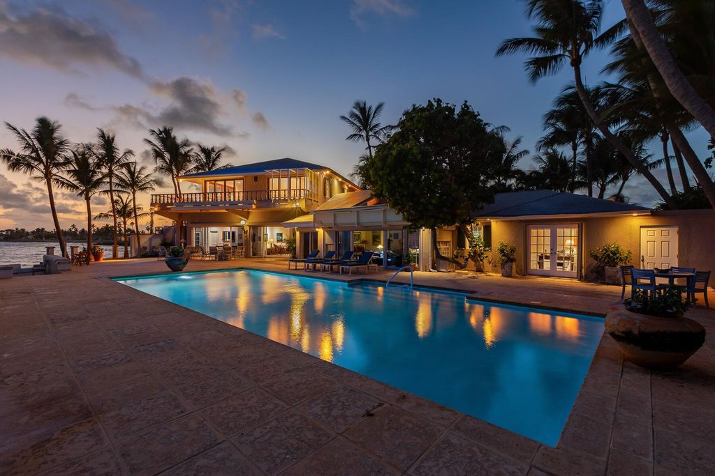 Discover luxury in the Florida Keys with this historic 5-bedroom, 5.5-bathroom home, situated at 400 South St, Key West, FL 33040. Adjacent to the iconic Southernmost Point buoy, this 4,008 square feet residence blends historic charm with modern amenities.