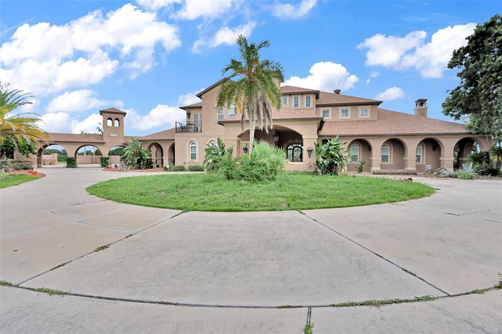 Nestled on 16 acres of meticulously landscaped grounds, this grand mansion boasts nearly 20,000 square feet of exquisitely designed living space.