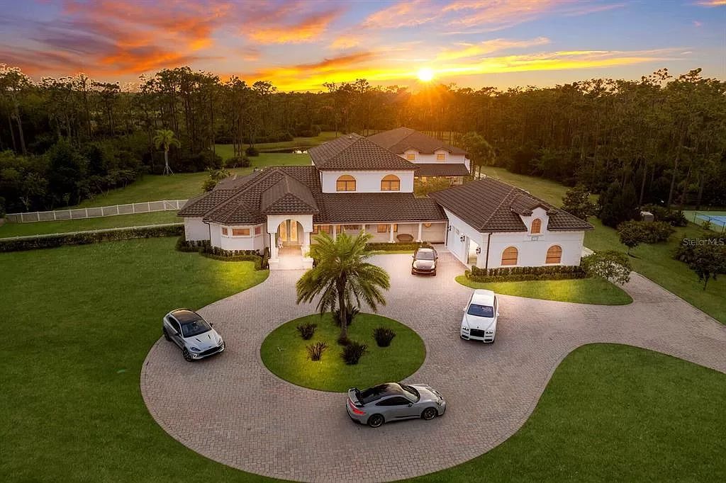 Nestled within the prestigious equestrian community of Foxwood at Panther Ridge, this extraordinary 13-acre estate offers unparalleled luxury country living.