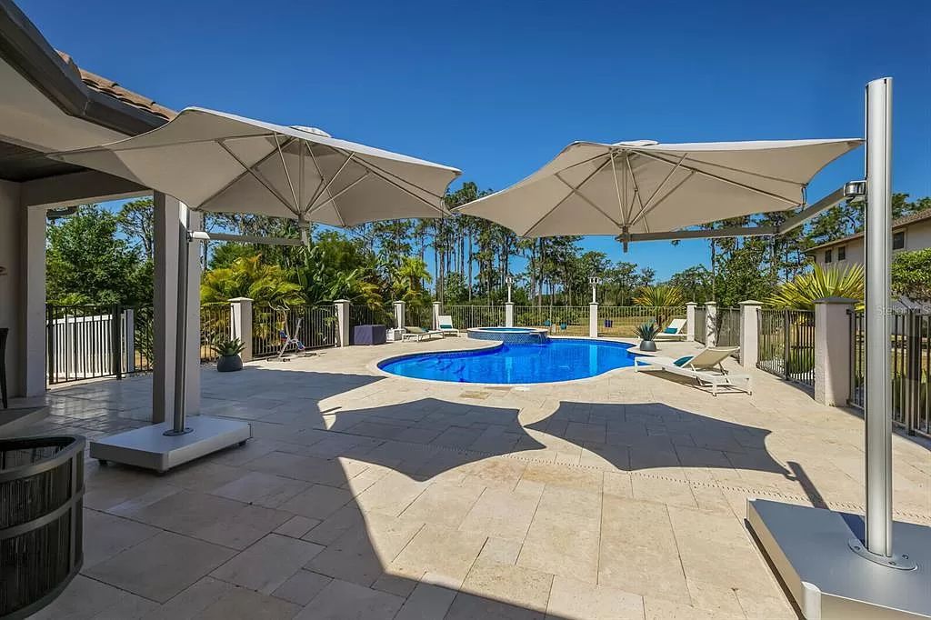 Nestled within the prestigious equestrian community of Foxwood at Panther Ridge, this extraordinary 13-acre estate offers unparalleled luxury country living.