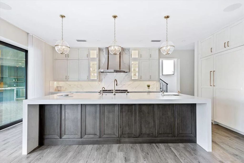 Welcome to this luxurious estate in the prestigious Aero Club. Featuring 7 bedrooms, 8 1/2 bathrooms, and 3 1/2 kitchens, this home is designed for ultimate comfort.