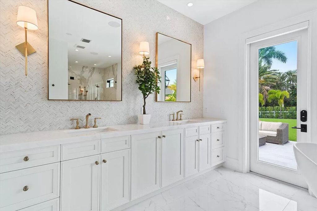 Welcome to this luxurious estate in the prestigious Aero Club. Featuring 7 bedrooms, 8 1/2 bathrooms, and 3 1/2 kitchens, this home is designed for ultimate comfort.