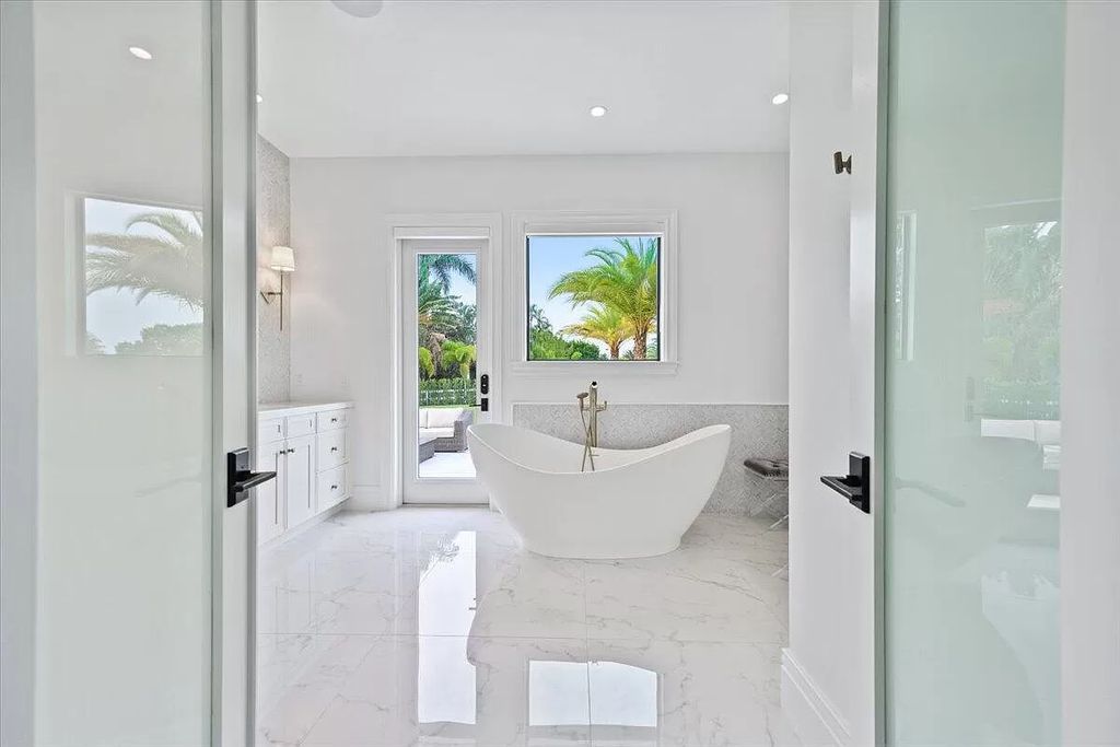 Welcome to this luxurious estate in the prestigious Aero Club. Featuring 7 bedrooms, 8 1/2 bathrooms, and 3 1/2 kitchens, this home is designed for ultimate comfort.