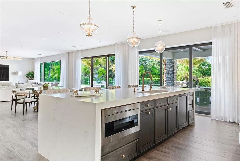 Welcome to this luxurious estate in the prestigious Aero Club. Featuring 7 bedrooms, 8 1/2 bathrooms, and 3 1/2 kitchens, this home is designed for ultimate comfort.