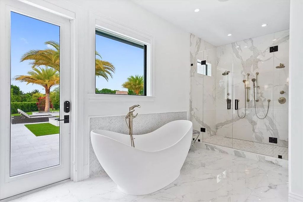 Welcome to this luxurious estate in the prestigious Aero Club. Featuring 7 bedrooms, 8 1/2 bathrooms, and 3 1/2 kitchens, this home is designed for ultimate comfort.