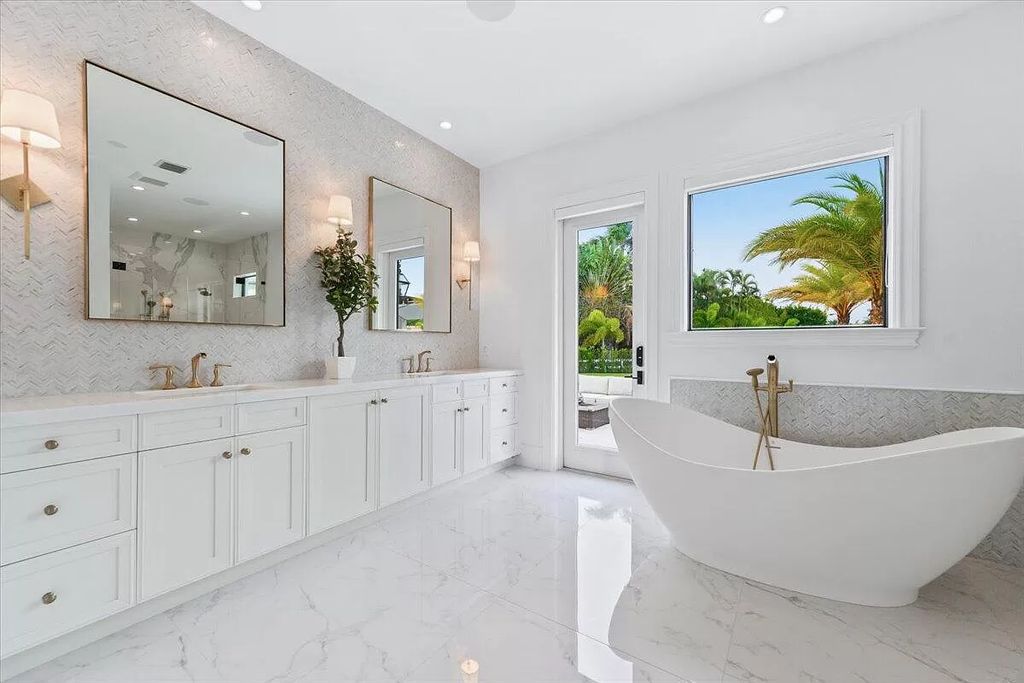 Welcome to this luxurious estate in the prestigious Aero Club. Featuring 7 bedrooms, 8 1/2 bathrooms, and 3 1/2 kitchens, this home is designed for ultimate comfort.