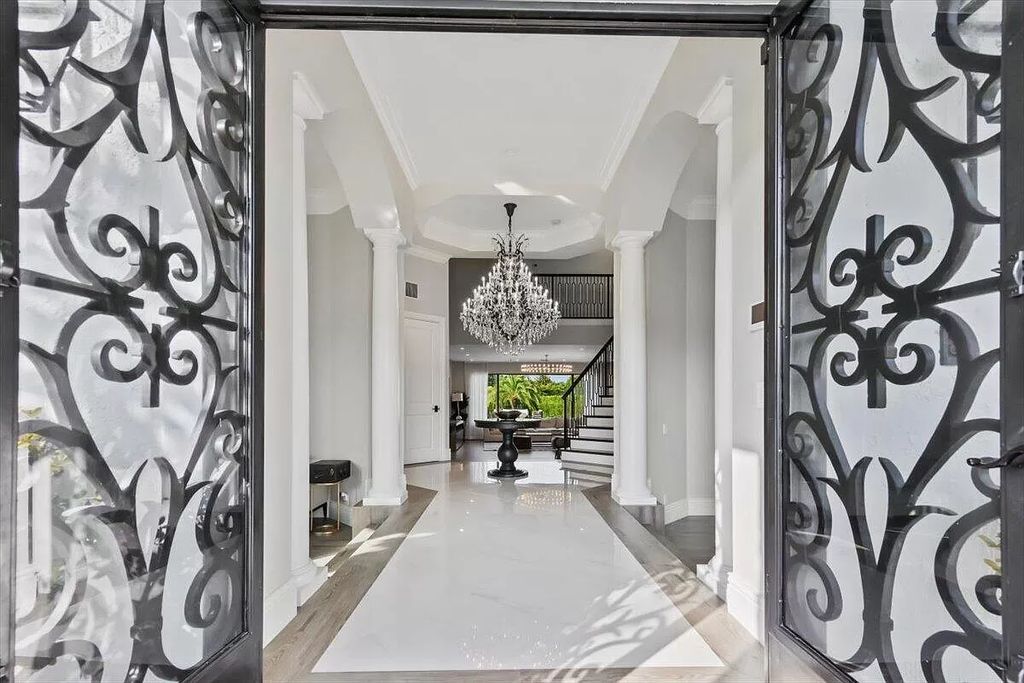 Welcome to this luxurious estate in the prestigious Aero Club. Featuring 7 bedrooms, 8 1/2 bathrooms, and 3 1/2 kitchens, this home is designed for ultimate comfort.