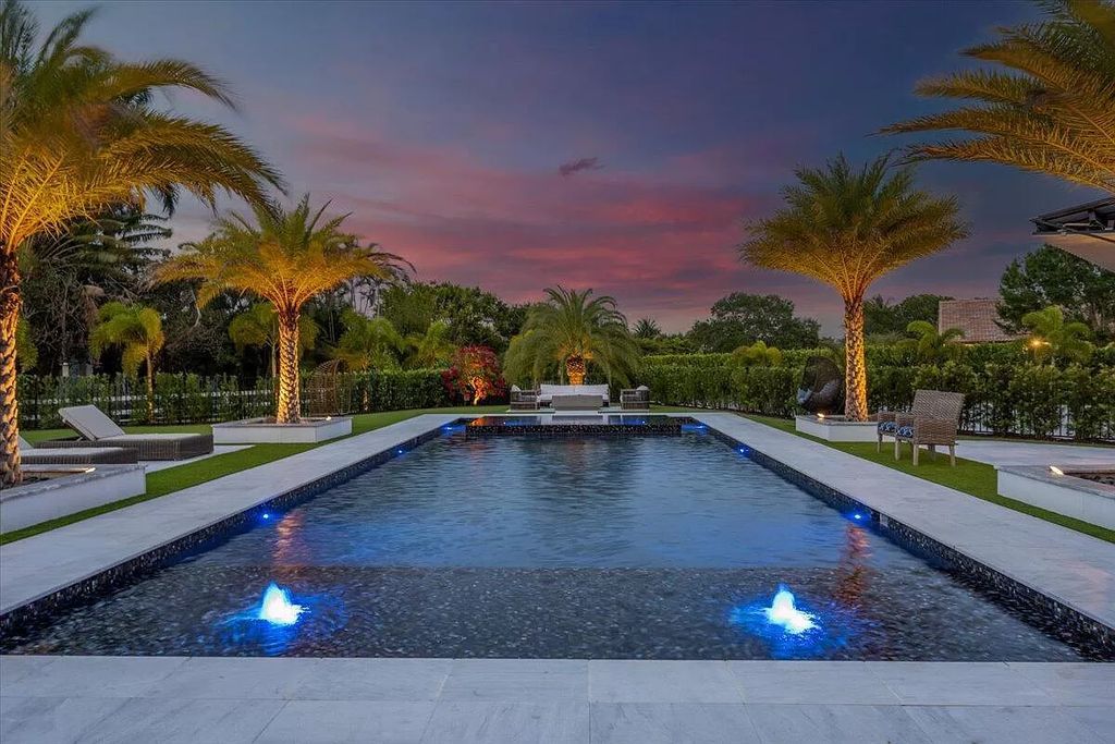 Welcome to this luxurious estate in the prestigious Aero Club. Featuring 7 bedrooms, 8 1/2 bathrooms, and 3 1/2 kitchens, this home is designed for ultimate comfort.