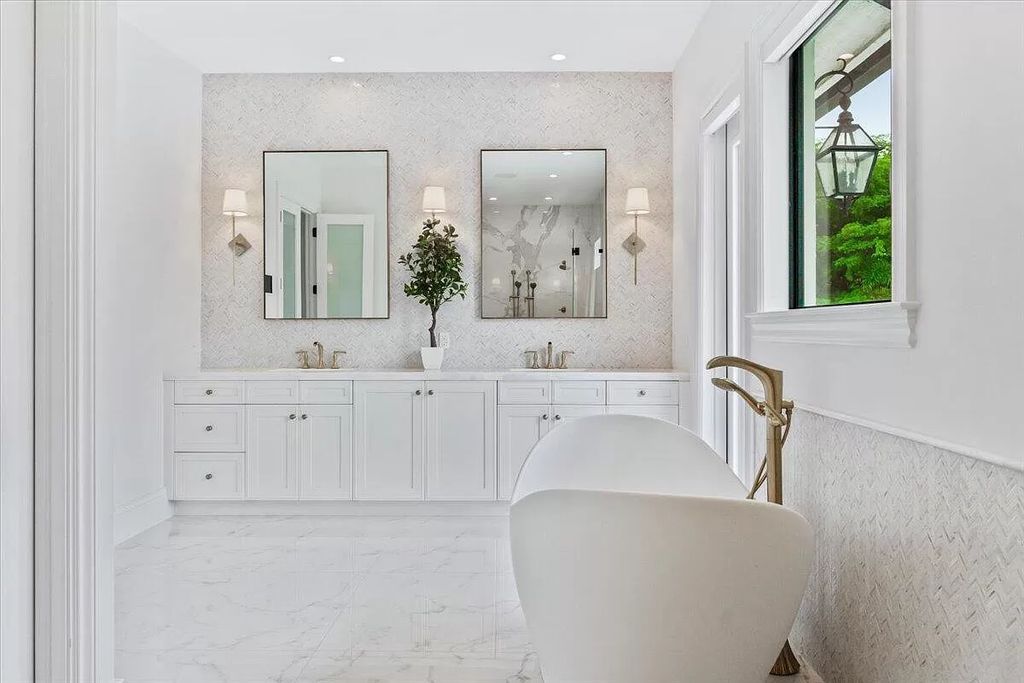 Welcome to this luxurious estate in the prestigious Aero Club. Featuring 7 bedrooms, 8 1/2 bathrooms, and 3 1/2 kitchens, this home is designed for ultimate comfort.
