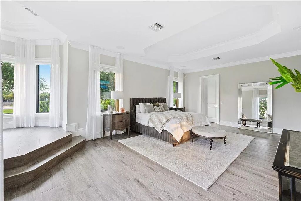 Welcome to this luxurious estate in the prestigious Aero Club. Featuring 7 bedrooms, 8 1/2 bathrooms, and 3 1/2 kitchens, this home is designed for ultimate comfort.