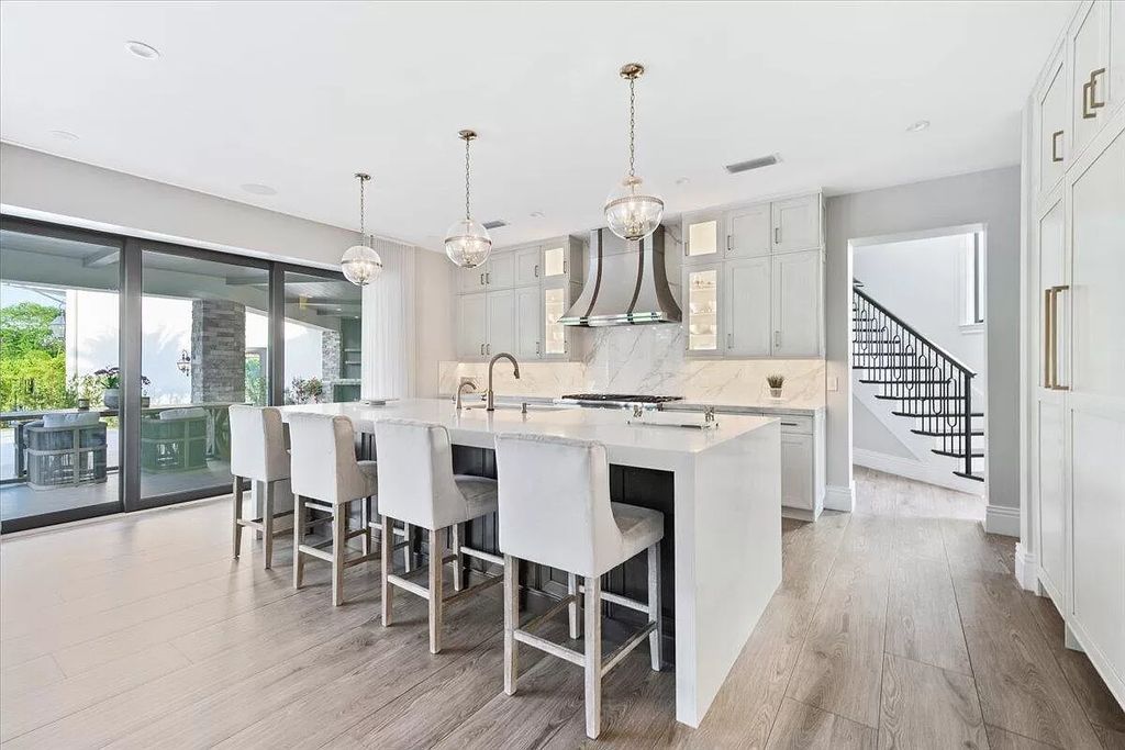 Welcome to this luxurious estate in the prestigious Aero Club. Featuring 7 bedrooms, 8 1/2 bathrooms, and 3 1/2 kitchens, this home is designed for ultimate comfort.