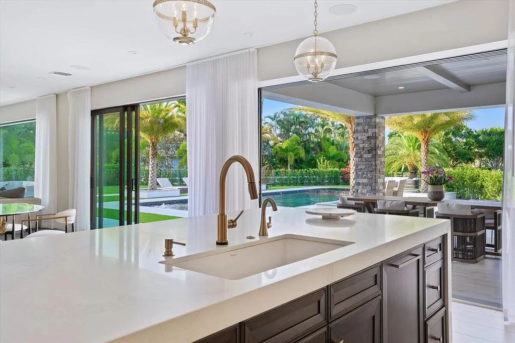 Welcome to this luxurious estate in the prestigious Aero Club. Featuring 7 bedrooms, 8 1/2 bathrooms, and 3 1/2 kitchens, this home is designed for ultimate comfort.