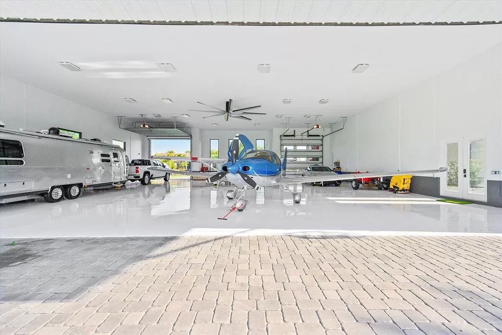 Welcome to this luxurious estate in the prestigious Aero Club. Featuring 7 bedrooms, 8 1/2 bathrooms, and 3 1/2 kitchens, this home is designed for ultimate comfort.