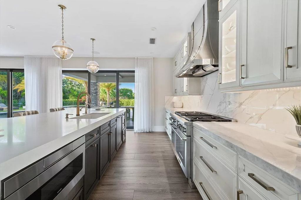 Welcome to this luxurious estate in the prestigious Aero Club. Featuring 7 bedrooms, 8 1/2 bathrooms, and 3 1/2 kitchens, this home is designed for ultimate comfort.