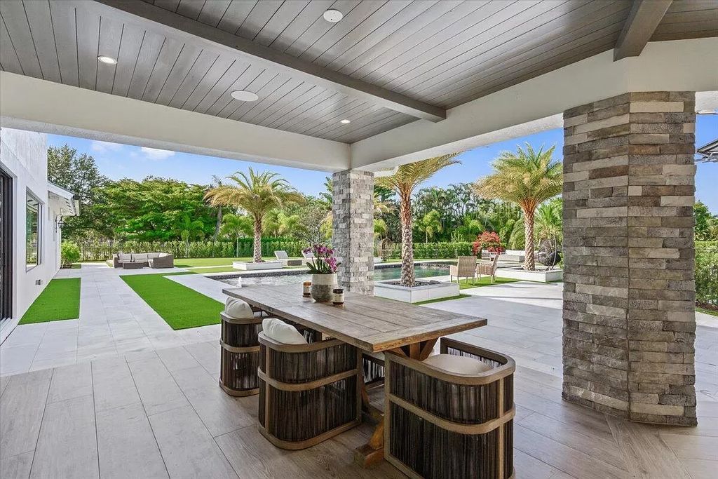 Welcome to this luxurious estate in the prestigious Aero Club. Featuring 7 bedrooms, 8 1/2 bathrooms, and 3 1/2 kitchens, this home is designed for ultimate comfort.