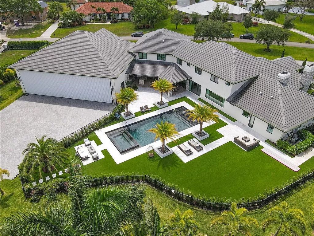 Welcome to this luxurious estate in the prestigious Aero Club. Featuring 7 bedrooms, 8 1/2 bathrooms, and 3 1/2 kitchens, this home is designed for ultimate comfort.