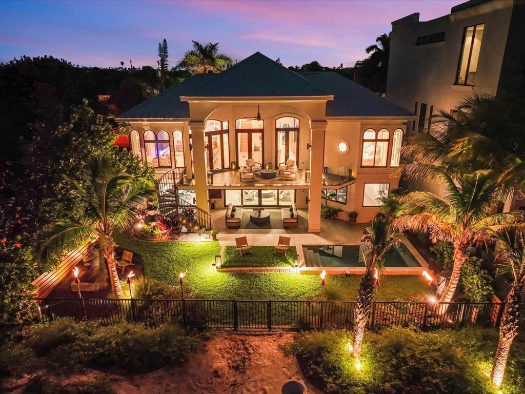 Enjoy modern elegance with breathtaking ocean views, a gourmet kitchen with marble countertops, a state-of-the-art water vapor fireplace, and over 10 TVs.