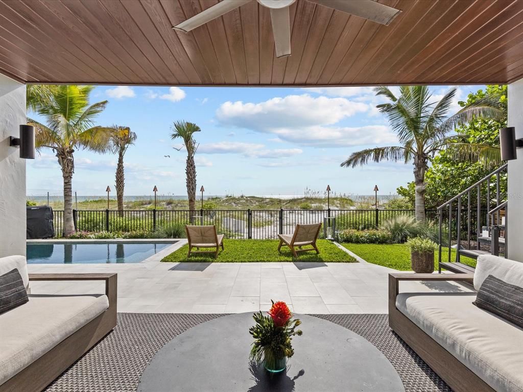 Enjoy modern elegance with breathtaking ocean views, a gourmet kitchen with marble countertops, a state-of-the-art water vapor fireplace, and over 10 TVs.