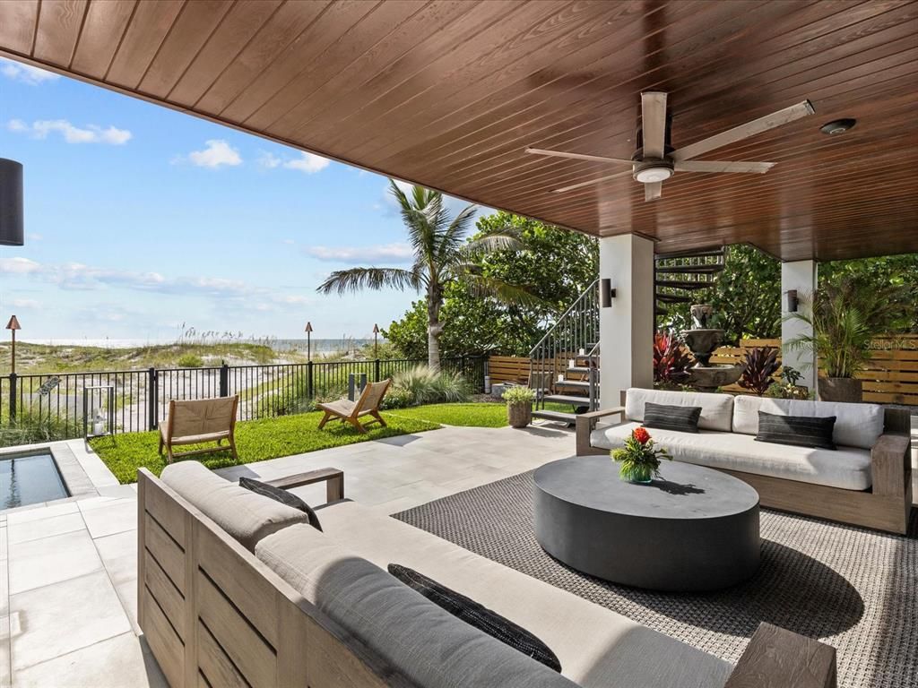 Enjoy modern elegance with breathtaking ocean views, a gourmet kitchen with marble countertops, a state-of-the-art water vapor fireplace, and over 10 TVs.