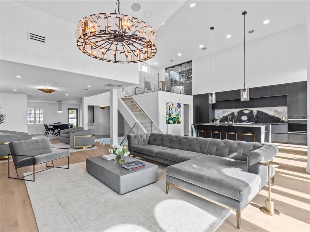 Enjoy modern elegance with breathtaking ocean views, a gourmet kitchen with marble countertops, a state-of-the-art water vapor fireplace, and over 10 TVs.