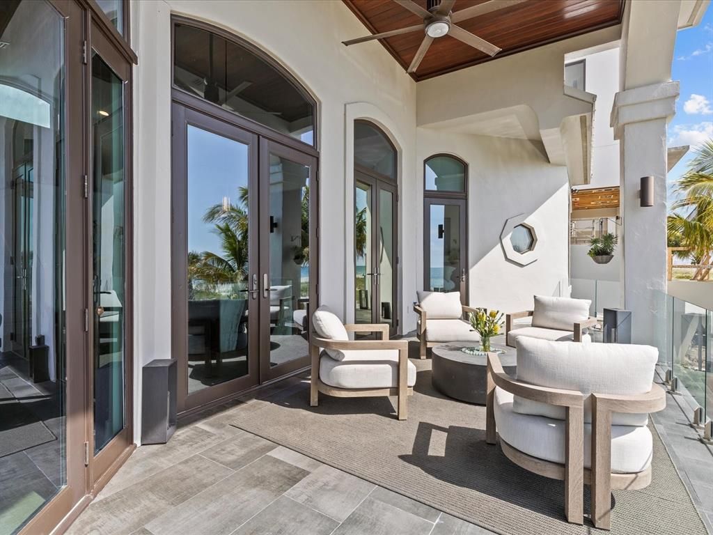 Enjoy modern elegance with breathtaking ocean views, a gourmet kitchen with marble countertops, a state-of-the-art water vapor fireplace, and over 10 TVs.