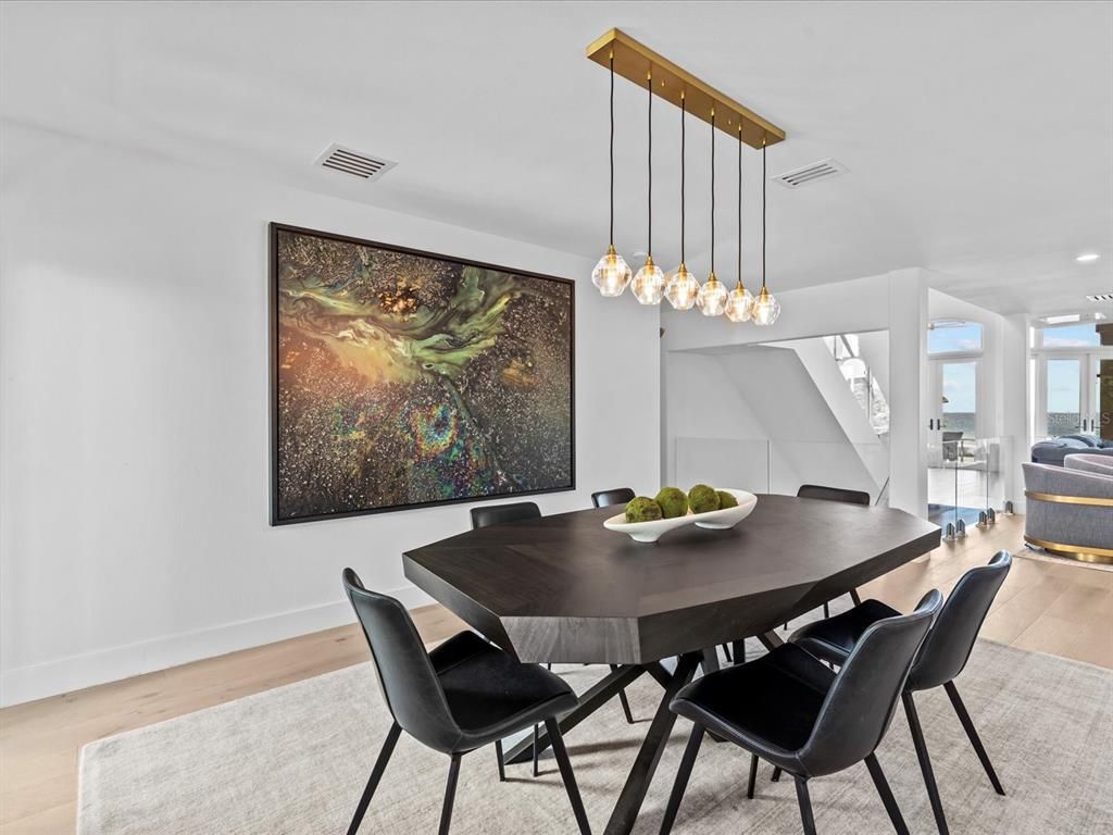 Enjoy modern elegance with breathtaking ocean views, a gourmet kitchen with marble countertops, a state-of-the-art water vapor fireplace, and over 10 TVs.