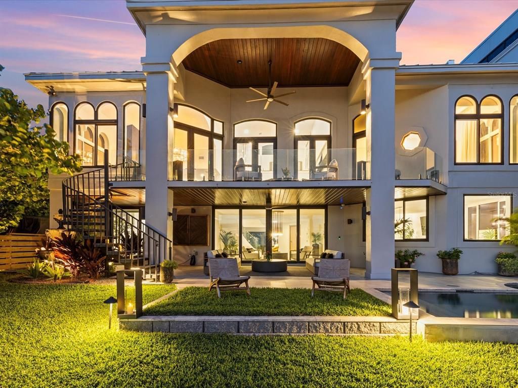 Enjoy modern elegance with breathtaking ocean views, a gourmet kitchen with marble countertops, a state-of-the-art water vapor fireplace, and over 10 TVs.