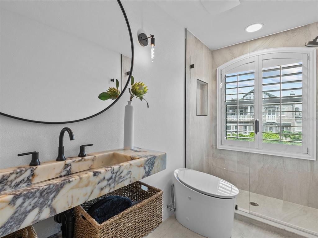 Enjoy modern elegance with breathtaking ocean views, a gourmet kitchen with marble countertops, a state-of-the-art water vapor fireplace, and over 10 TVs.