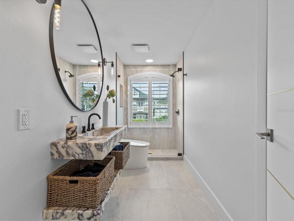 Enjoy modern elegance with breathtaking ocean views, a gourmet kitchen with marble countertops, a state-of-the-art water vapor fireplace, and over 10 TVs.