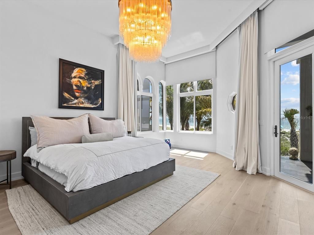 Enjoy modern elegance with breathtaking ocean views, a gourmet kitchen with marble countertops, a state-of-the-art water vapor fireplace, and over 10 TVs.