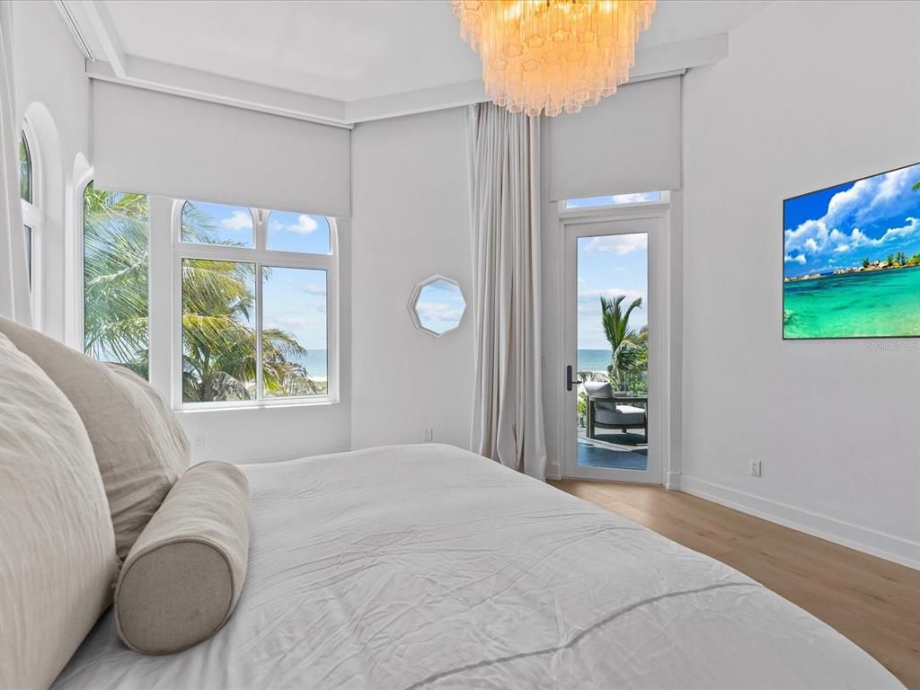 Enjoy modern elegance with breathtaking ocean views, a gourmet kitchen with marble countertops, a state-of-the-art water vapor fireplace, and over 10 TVs.