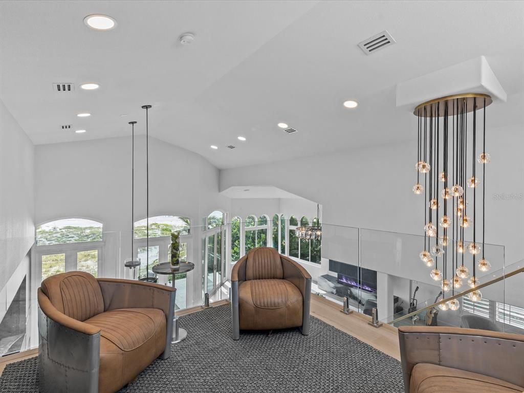 Enjoy modern elegance with breathtaking ocean views, a gourmet kitchen with marble countertops, a state-of-the-art water vapor fireplace, and over 10 TVs.