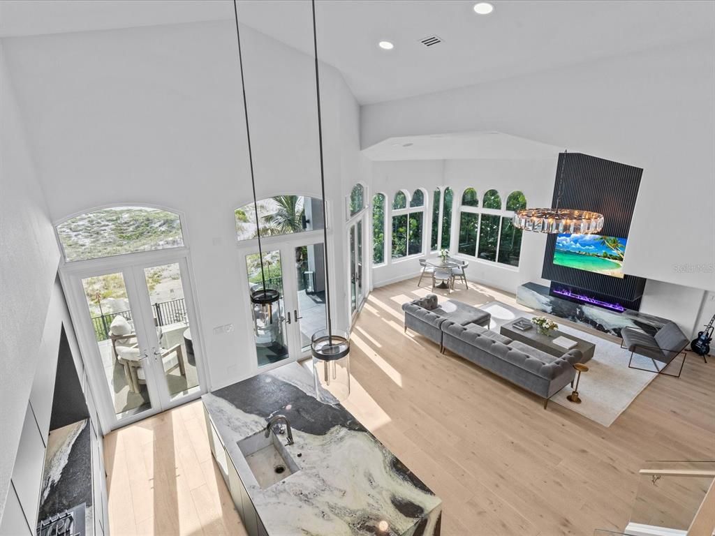 Enjoy modern elegance with breathtaking ocean views, a gourmet kitchen with marble countertops, a state-of-the-art water vapor fireplace, and over 10 TVs.