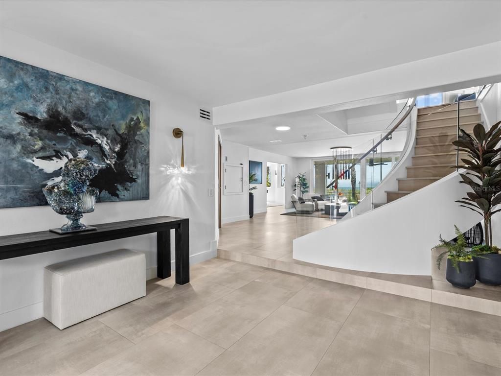 Enjoy modern elegance with breathtaking ocean views, a gourmet kitchen with marble countertops, a state-of-the-art water vapor fireplace, and over 10 TVs.