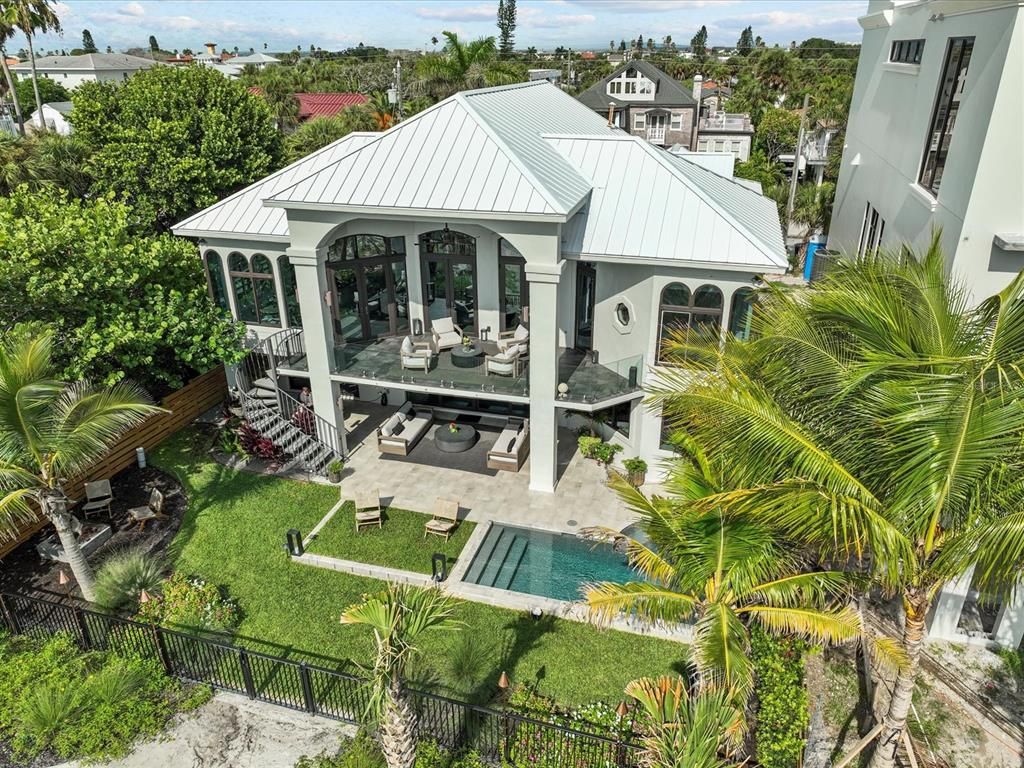 Enjoy modern elegance with breathtaking ocean views, a gourmet kitchen with marble countertops, a state-of-the-art water vapor fireplace, and over 10 TVs.