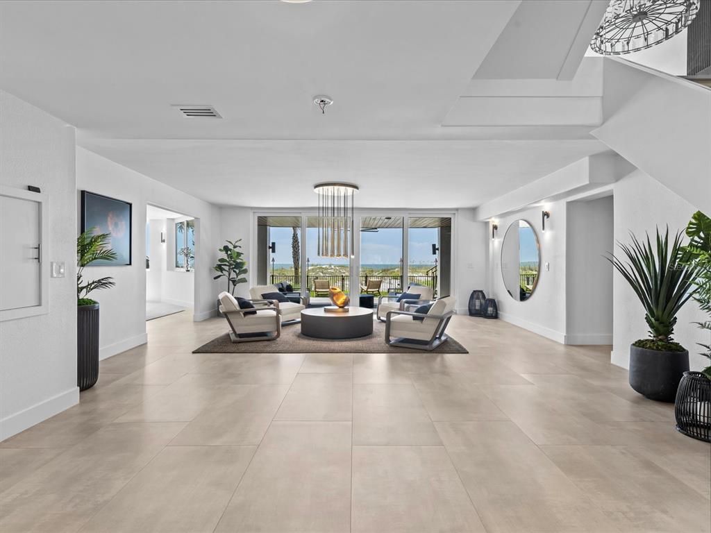 Enjoy modern elegance with breathtaking ocean views, a gourmet kitchen with marble countertops, a state-of-the-art water vapor fireplace, and over 10 TVs.