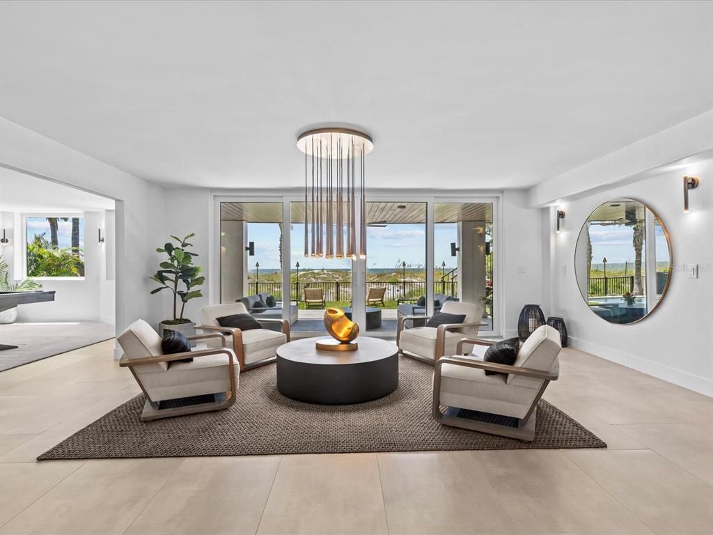 Enjoy modern elegance with breathtaking ocean views, a gourmet kitchen with marble countertops, a state-of-the-art water vapor fireplace, and over 10 TVs.