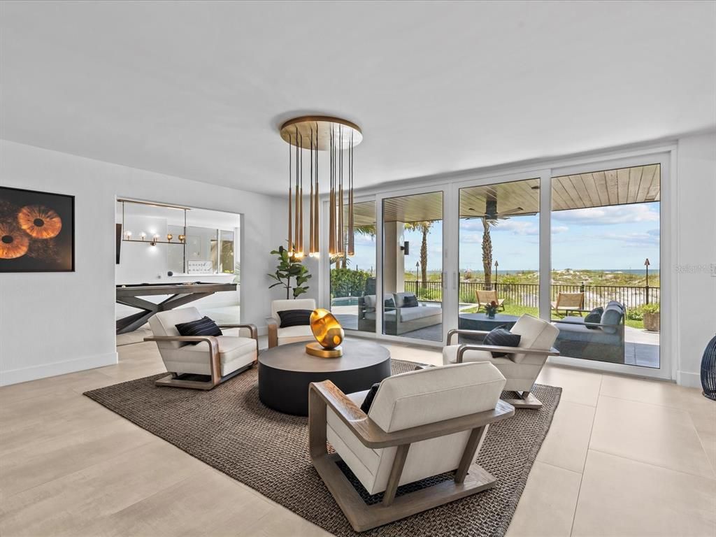 Enjoy modern elegance with breathtaking ocean views, a gourmet kitchen with marble countertops, a state-of-the-art water vapor fireplace, and over 10 TVs.