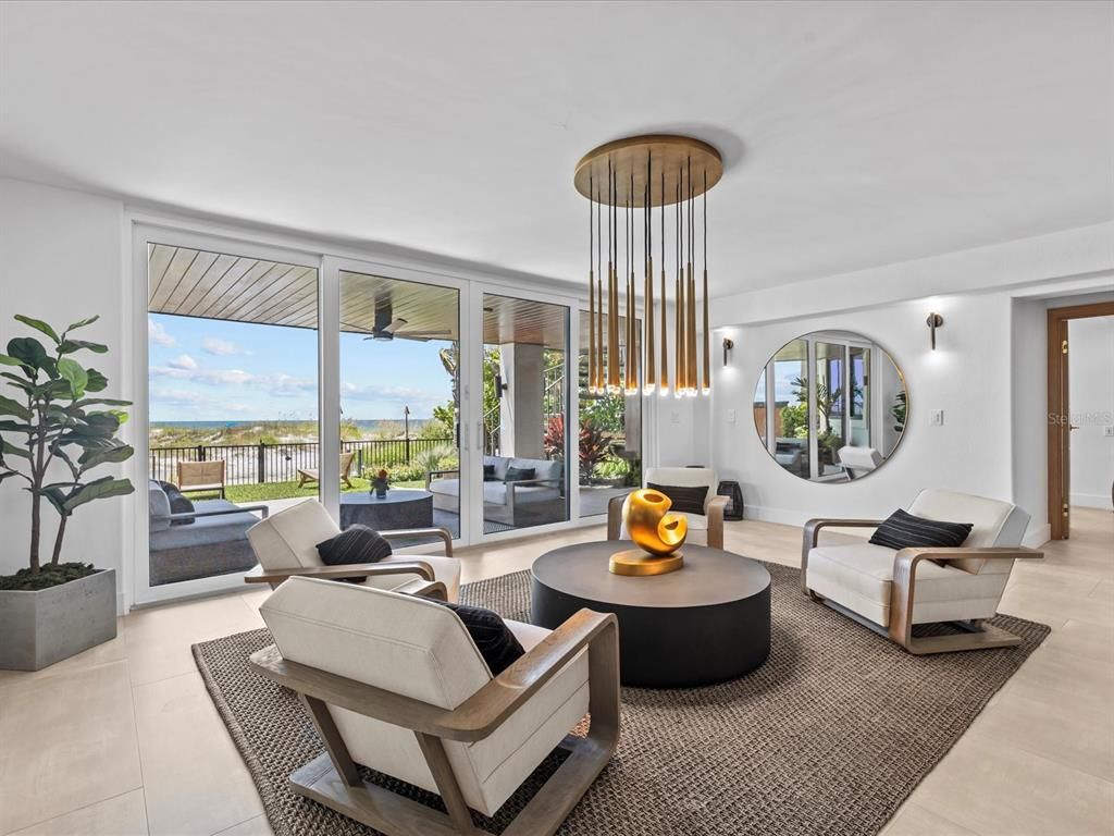 Enjoy modern elegance with breathtaking ocean views, a gourmet kitchen with marble countertops, a state-of-the-art water vapor fireplace, and over 10 TVs.