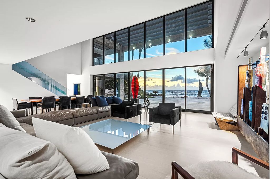 This 6-bed, 6-bath home features a soaring great room with ocean views, a fabulous new chef's kitchen, a guest house, and a resort-style outdoor oasis complete with an infinity pool, koi pond with fountain, and Intracoastal dock