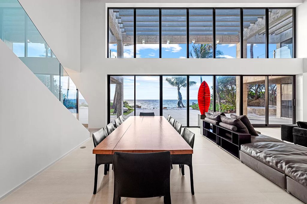 This 6-bed, 6-bath home features a soaring great room with ocean views, a fabulous new chef's kitchen, a guest house, and a resort-style outdoor oasis complete with an infinity pool, koi pond with fountain, and Intracoastal dock