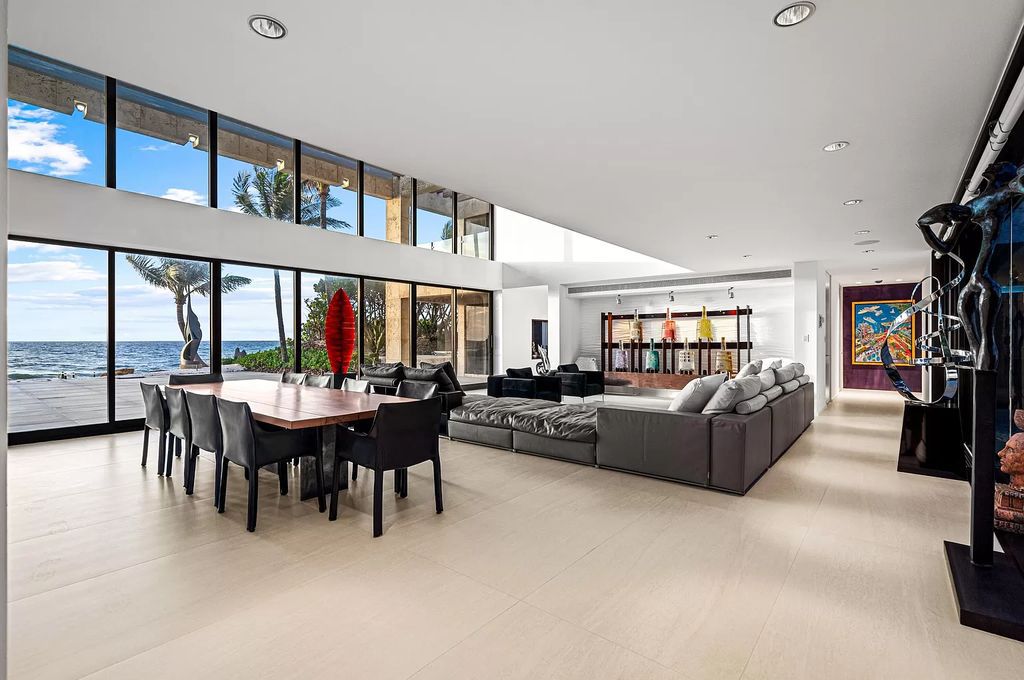 This 6-bed, 6-bath home features a soaring great room with ocean views, a fabulous new chef's kitchen, a guest house, and a resort-style outdoor oasis complete with an infinity pool, koi pond with fountain, and Intracoastal dock